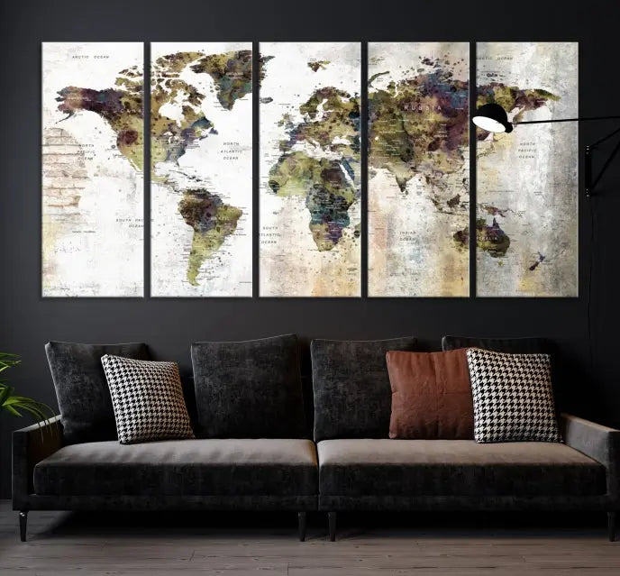 The Watercolor World Map Wall Art Canvas Print adorns the dark wall, creating a striking focal point.