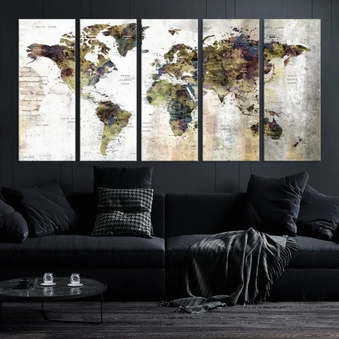 The Watercolor World Map Wall Art Canvas Print adorns the dark wall, creating a striking focal point.