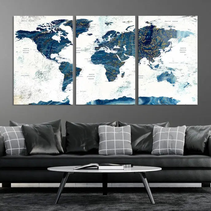 Hanging above is the Watercolor World Map Wall Art Canvas Print, displayed in blue and white tones on museum-quality canvas with a gallery wrap.