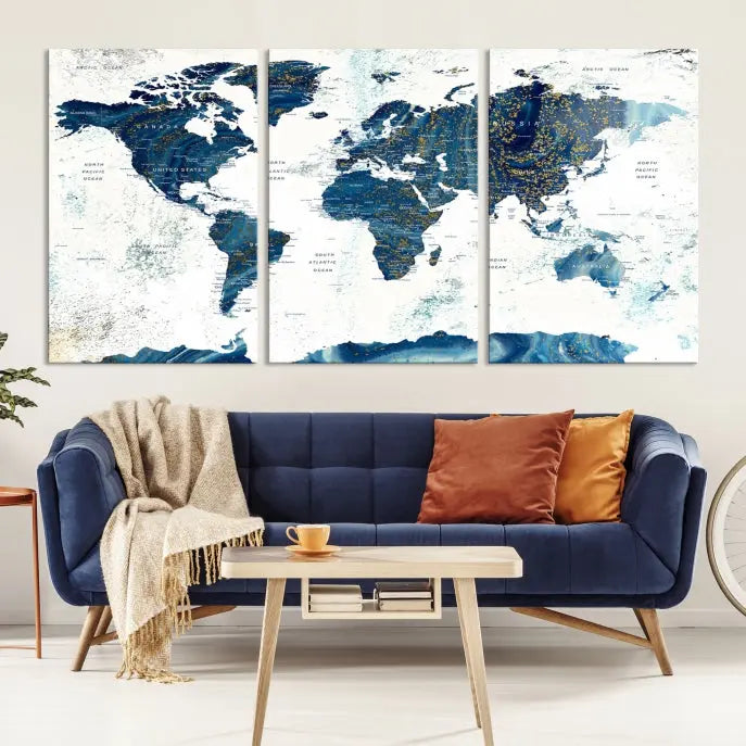 Hanging above is the Watercolor World Map Wall Art Canvas Print, displayed in blue and white tones on museum-quality canvas with a gallery wrap.