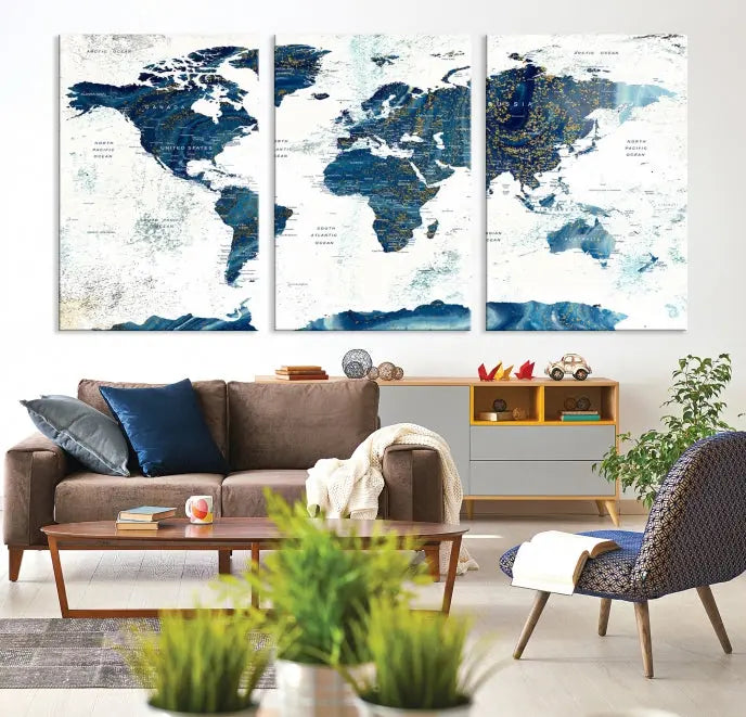 Hanging above is the Watercolor World Map Wall Art Canvas Print, displayed in blue and white tones on museum-quality canvas with a gallery wrap.