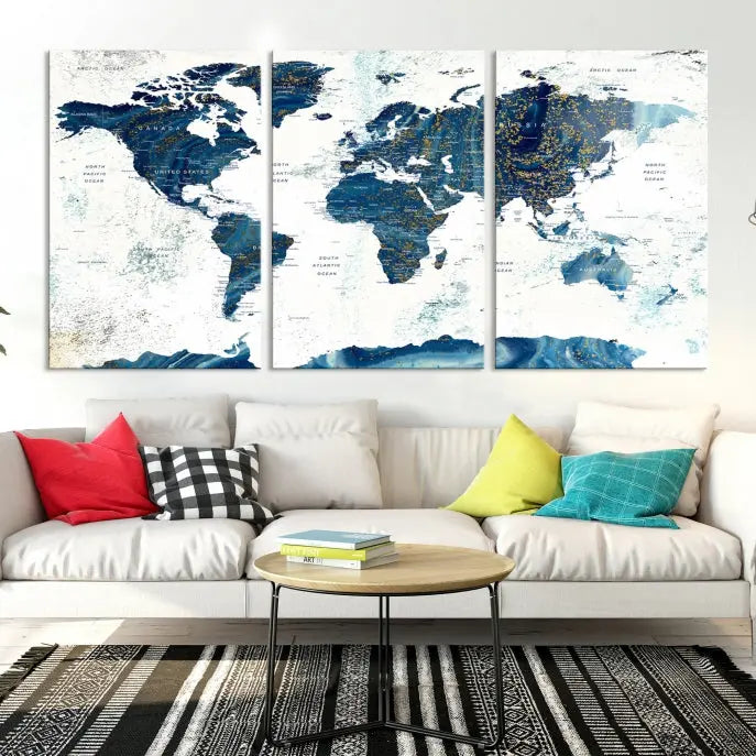 Hanging above is the Watercolor World Map Wall Art Canvas Print, displayed in blue and white tones on museum-quality canvas with a gallery wrap.