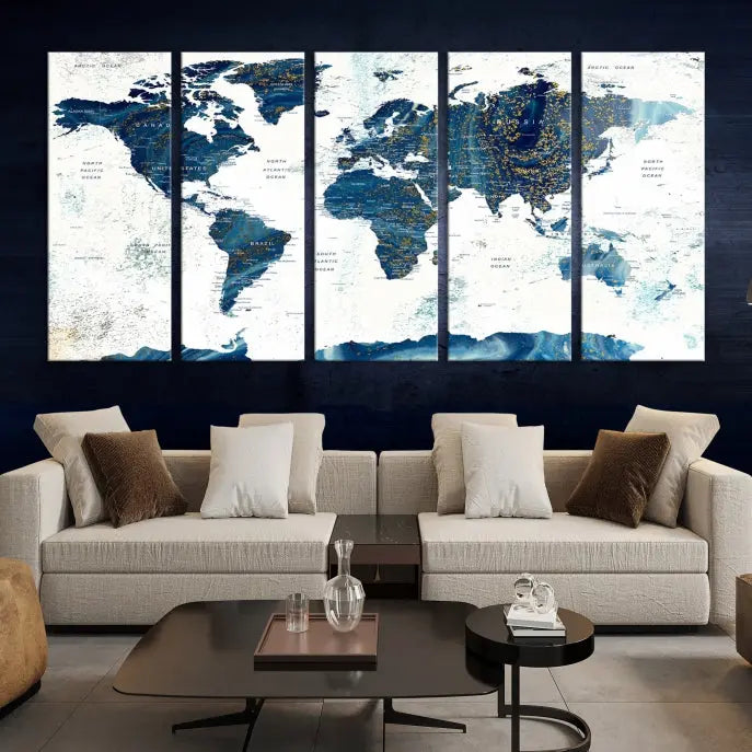 Hanging above is the Watercolor World Map Wall Art Canvas Print, displayed in blue and white tones on museum-quality canvas with a gallery wrap.