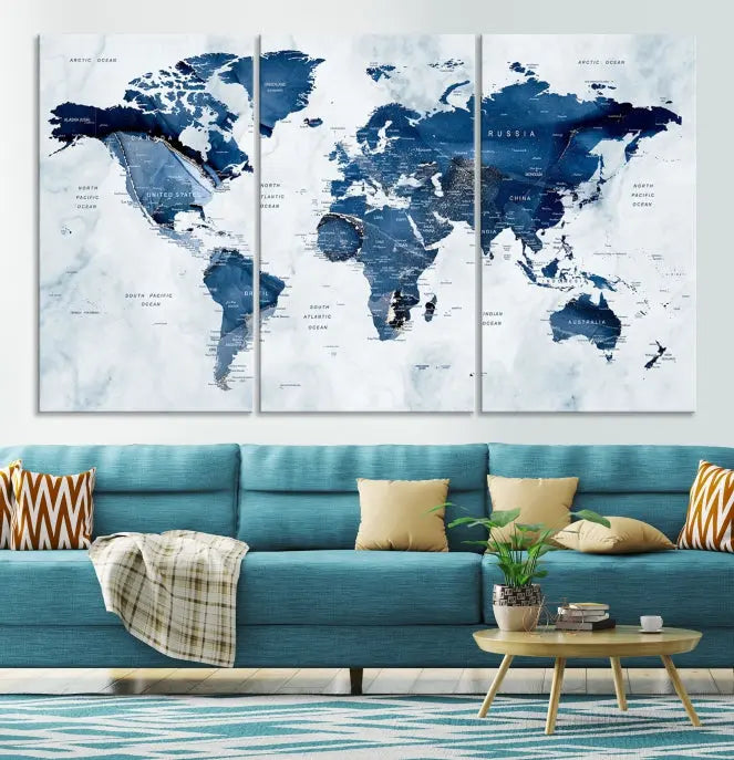 A beautifully gallery-wrapped Watercolor World Map Wall Art Canvas Print in dark blue hues hangs on the wall.