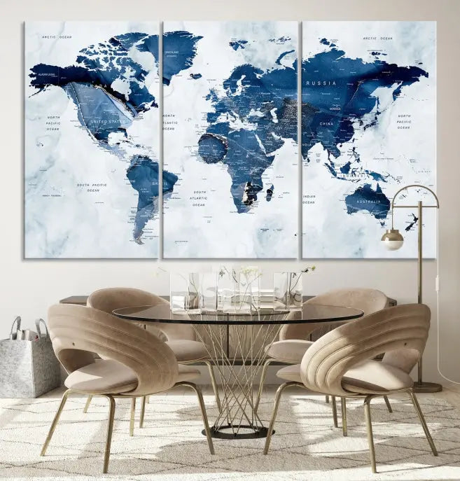 A beautifully gallery-wrapped Watercolor World Map Wall Art Canvas Print in dark blue hues hangs on the wall.