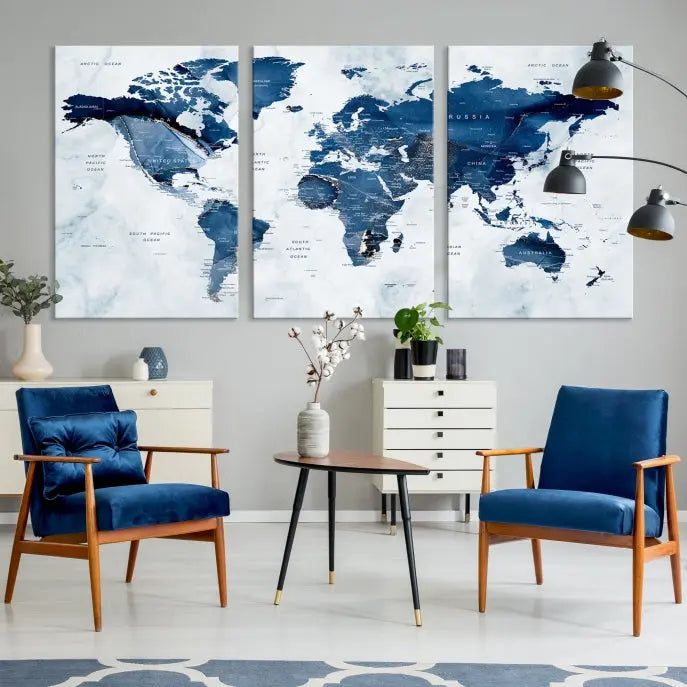 A beautifully gallery-wrapped Watercolor World Map Wall Art Canvas Print in dark blue hues hangs on the wall.