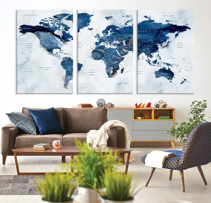 A beautifully gallery-wrapped Watercolor World Map Wall Art Canvas Print in dark blue hues hangs on the wall.