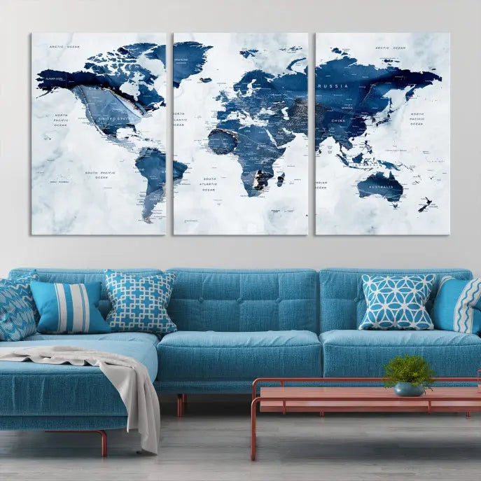 A beautifully gallery-wrapped Watercolor World Map Wall Art Canvas Print in dark blue hues hangs on the wall.