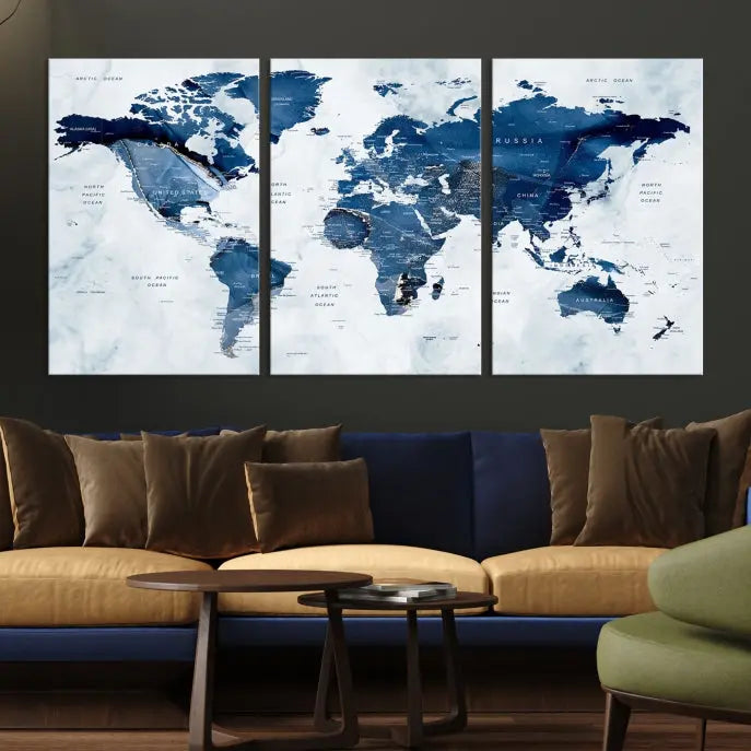 A beautifully gallery-wrapped Watercolor World Map Wall Art Canvas Print in dark blue hues hangs on the wall.