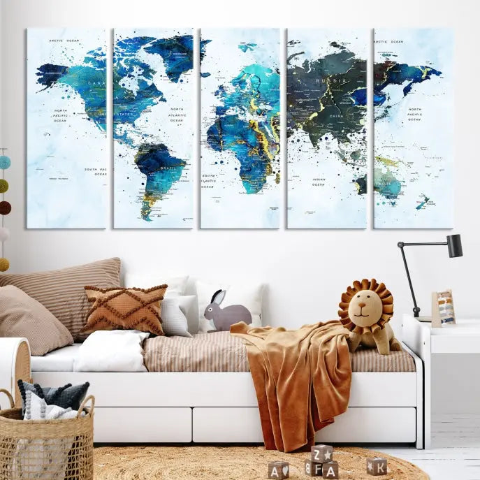 A Watercolor World Map Wall Art Canvas Print, arranged as a gallery-wrapped triptych in soothing blue and green tones, is displayed prominently.