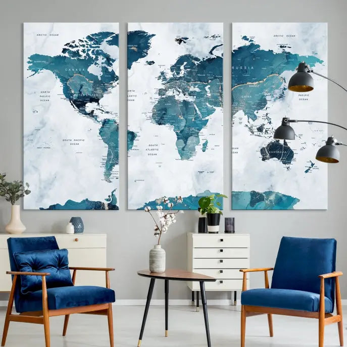 The Watercolor World Map Wall Art Canvas Print, rendered in blue tones and crafted on museum-quality canvas with a UV-protective coating, is elegantly displayed on the wall.