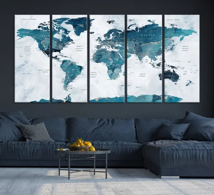 The Watercolor World Map Wall Art Canvas Print, rendered in blue tones and crafted on museum-quality canvas with a UV-protective coating, is elegantly displayed on the wall.