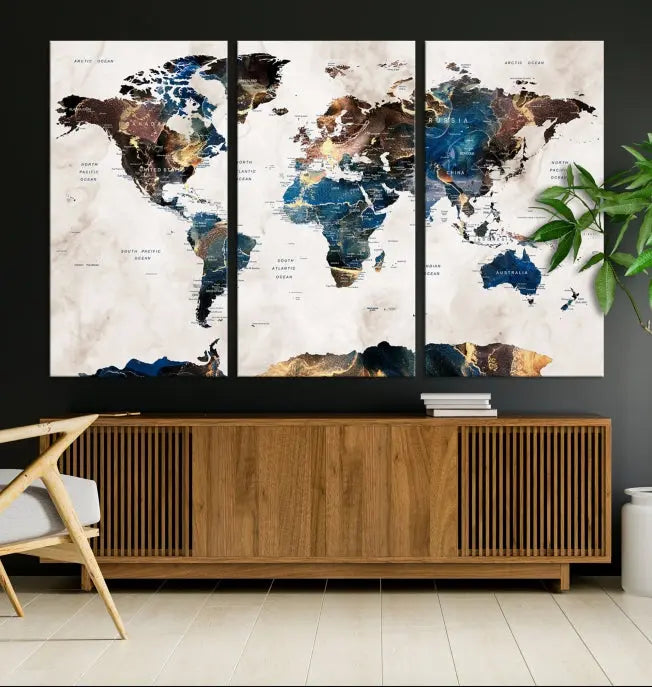 The Watercolor World Map Wall Art Canvas Print, a captivating three-panel artwork with a museum-quality finish and UV-protective coating, is stylishly displayed in the modern room.