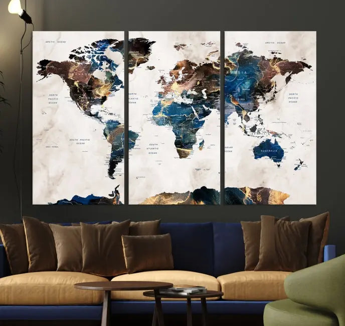 The Watercolor World Map Wall Art Canvas Print, a captivating three-panel artwork with a museum-quality finish and UV-protective coating, is stylishly displayed in the modern room.