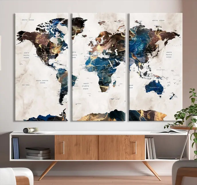 The Watercolor World Map Wall Art Canvas Print, a captivating three-panel artwork with a museum-quality finish and UV-protective coating, is stylishly displayed in the modern room.