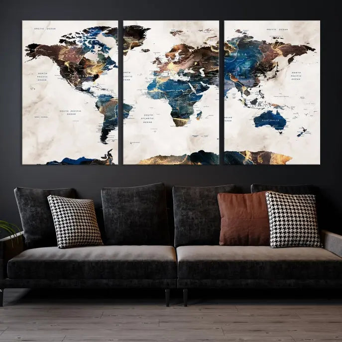 The Watercolor World Map Wall Art Canvas Print, a captivating three-panel artwork with a museum-quality finish and UV-protective coating, is stylishly displayed in the modern room.