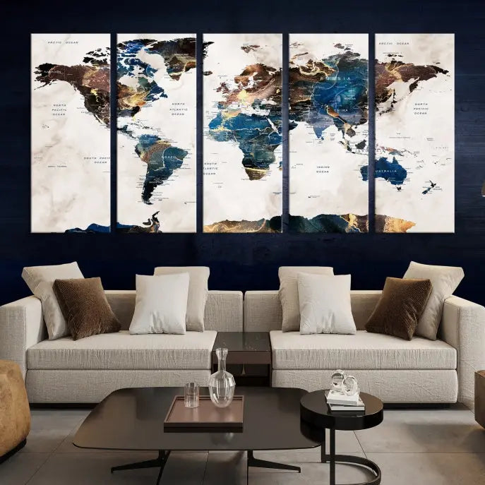 The Watercolor World Map Wall Art Canvas Print, a captivating three-panel artwork with a museum-quality finish and UV-protective coating, is stylishly displayed in the modern room.