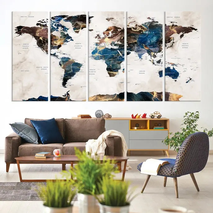 The Watercolor World Map Wall Art Canvas Print, a captivating three-panel artwork with a museum-quality finish and UV-protective coating, is stylishly displayed in the modern room.