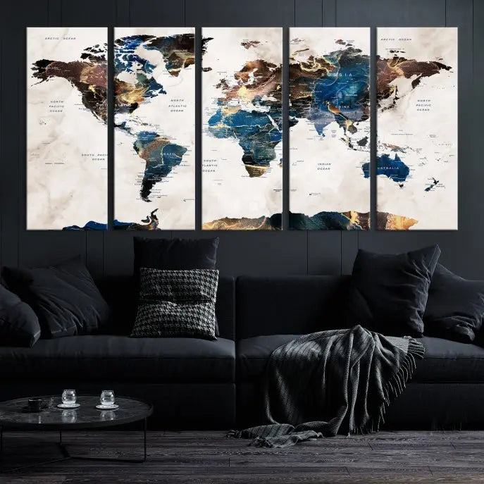 The Watercolor World Map Wall Art Canvas Print, a captivating three-panel artwork with a museum-quality finish and UV-protective coating, is stylishly displayed in the modern room.