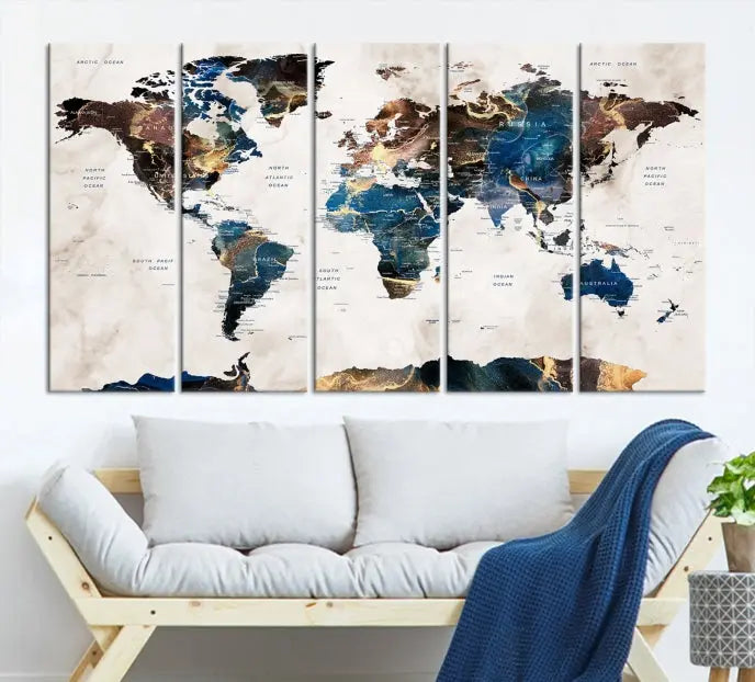 The Watercolor World Map Wall Art Canvas Print, a captivating three-panel artwork with a museum-quality finish and UV-protective coating, is stylishly displayed in the modern room.