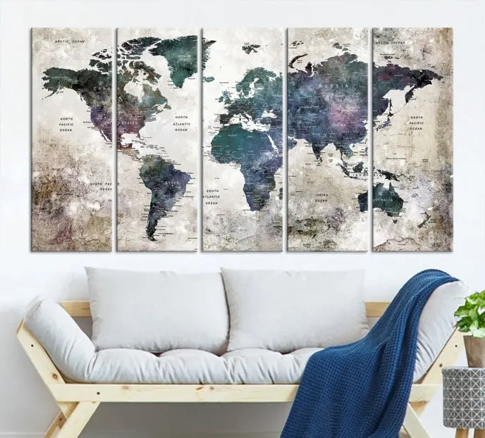 A Watercolor World Map Wall Art Canvas Print, designed in a vintage style on museum-quality canvas, hangs in the modern living room.