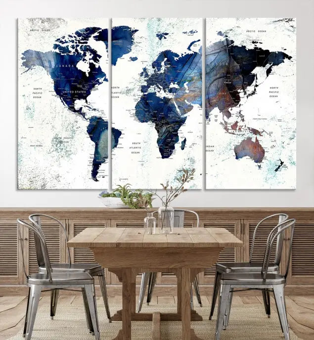 A modern living room showcases a Watercolor World Map Wall Art Canvas Print on the wall, crafted on museum-quality canvas. This artwork adds elegance to the space.