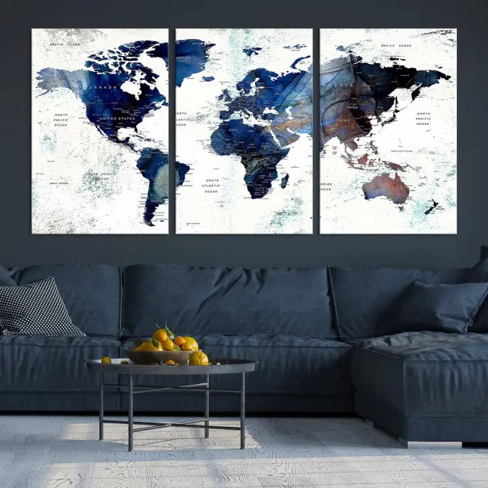 A modern living room showcases a Watercolor World Map Wall Art Canvas Print on the wall, crafted on museum-quality canvas. This artwork adds elegance to the space.