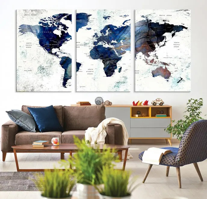 A modern living room showcases a Watercolor World Map Wall Art Canvas Print on the wall, crafted on museum-quality canvas. This artwork adds elegance to the space.