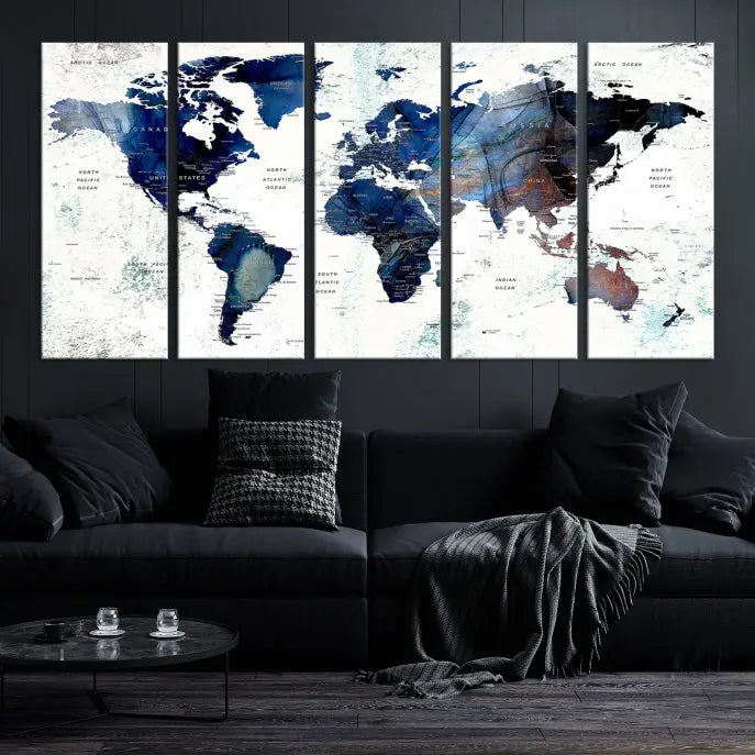 A modern living room showcases a Watercolor World Map Wall Art Canvas Print on the wall, crafted on museum-quality canvas. This artwork adds elegance to the space.