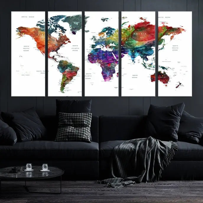 The "Watercolor World Map Wall Art Canvas Print," crafted by professional artisans, features three vibrant panels on museum-quality canvas, adorning the wall in a chic, minimalist room.