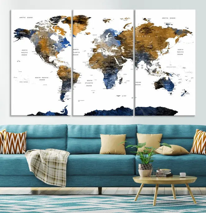 In a modern living room, the "Watercolor World Map Wall Art Canvas Print" is displayed, offering blue and gold tones on museum-quality canvas with UV protection.