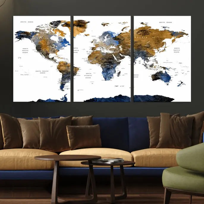 In a modern living room, the "Watercolor World Map Wall Art Canvas Print" is displayed, offering blue and gold tones on museum-quality canvas with UV protection.