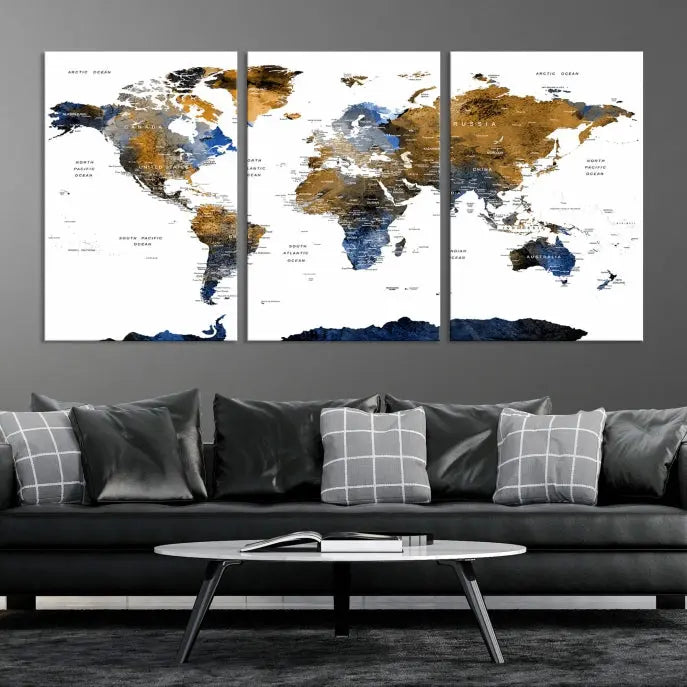 In a modern living room, the "Watercolor World Map Wall Art Canvas Print" is displayed, offering blue and gold tones on museum-quality canvas with UV protection.