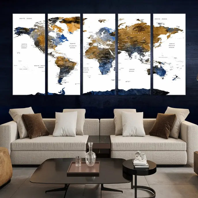 In a modern living room, the "Watercolor World Map Wall Art Canvas Print" is displayed, offering blue and gold tones on museum-quality canvas with UV protection.