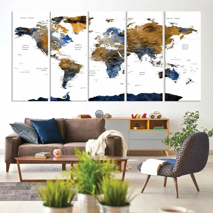 In a modern living room, the "Watercolor World Map Wall Art Canvas Print" is displayed, offering blue and gold tones on museum-quality canvas with UV protection.