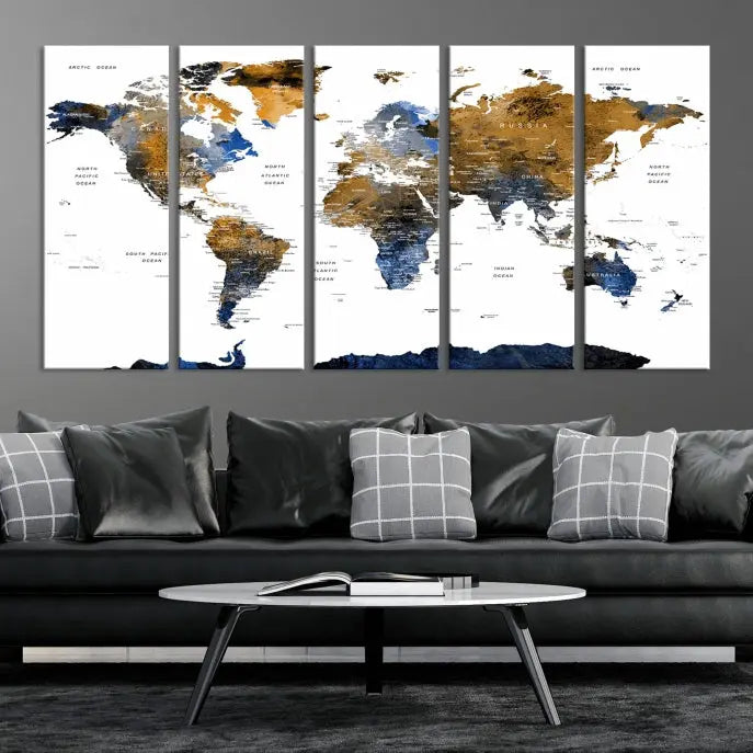 In a modern living room, the "Watercolor World Map Wall Art Canvas Print" is displayed, offering blue and gold tones on museum-quality canvas with UV protection.