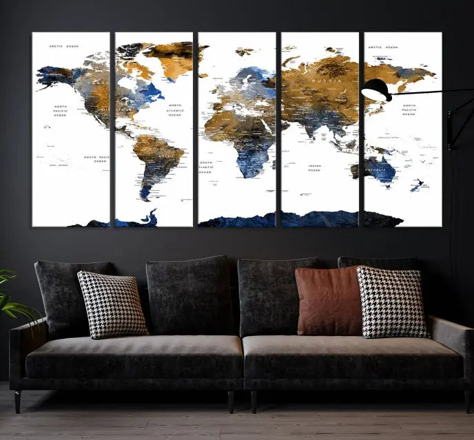 In a modern living room, the "Watercolor World Map Wall Art Canvas Print" is displayed, offering blue and gold tones on museum-quality canvas with UV protection.