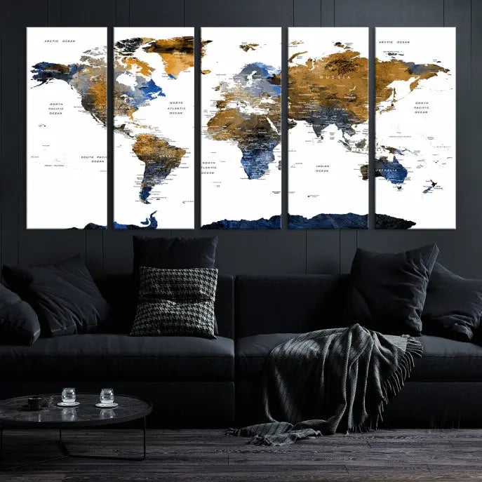 In a modern living room, the "Watercolor World Map Wall Art Canvas Print" is displayed, offering blue and gold tones on museum-quality canvas with UV protection.