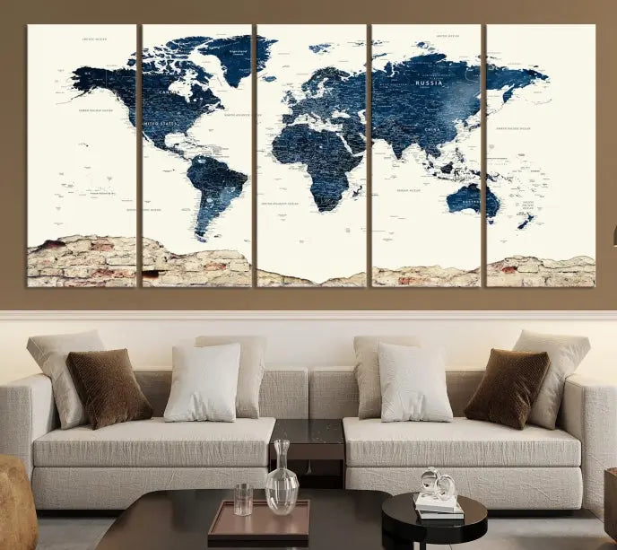 The Watercolor World Map Wall Art Canvas Print, crafted on museum-quality canvas, adorns the wall. Each piece is hand-assembled and features a UV-protective coating to ensure lasting beauty and vibrancy.