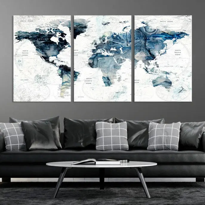 The Watercolor World Map Wall Art Canvas Print, a three-panel abstract masterpiece on museum-quality canvases, adorns the wall.