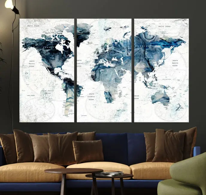 The Watercolor World Map Wall Art Canvas Print, a three-panel abstract masterpiece on museum-quality canvases, adorns the wall.