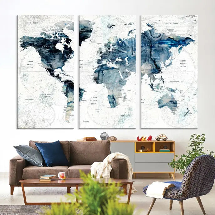 The Watercolor World Map Wall Art Canvas Print, a three-panel abstract masterpiece on museum-quality canvases, adorns the wall.