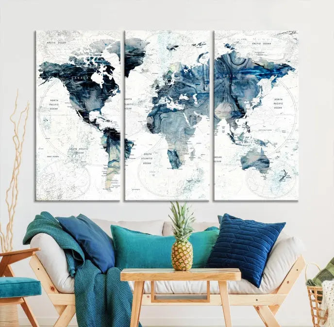 The Watercolor World Map Wall Art Canvas Print, a three-panel abstract masterpiece on museum-quality canvases, adorns the wall.