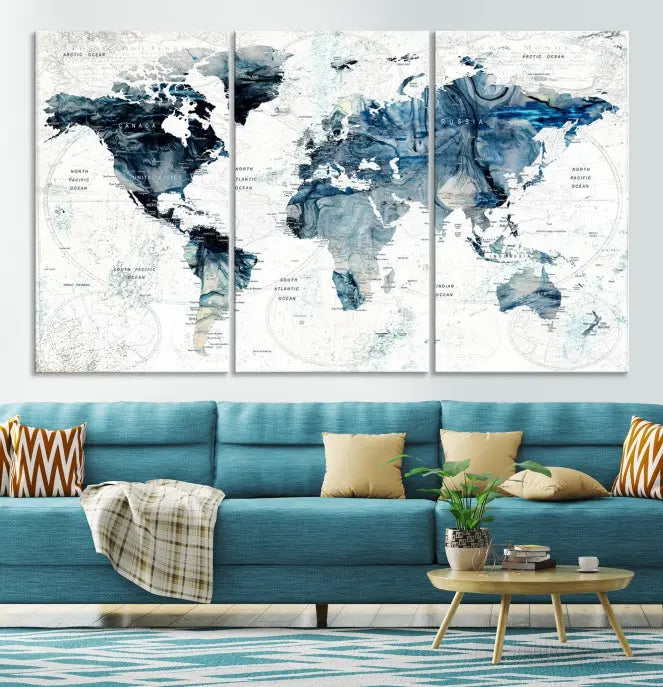 The Watercolor World Map Wall Art Canvas Print, a three-panel abstract masterpiece on museum-quality canvases, adorns the wall.