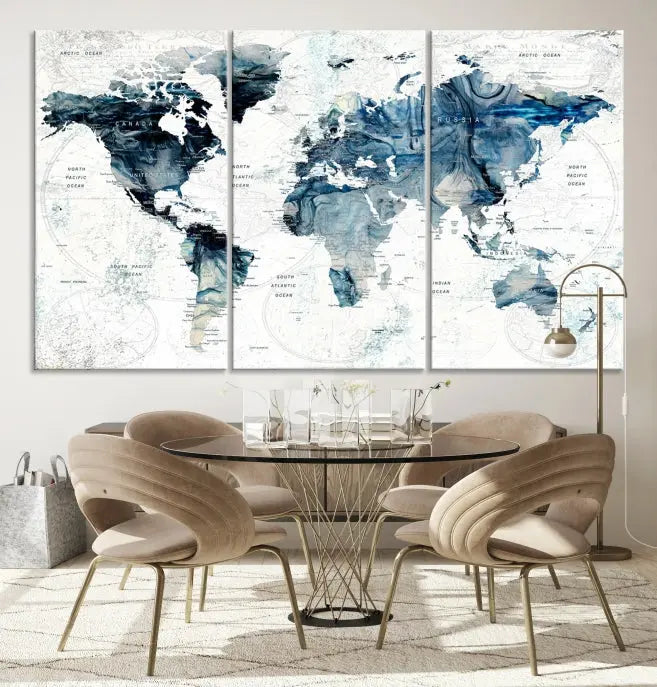 The Watercolor World Map Wall Art Canvas Print, a three-panel abstract masterpiece on museum-quality canvases, adorns the wall.