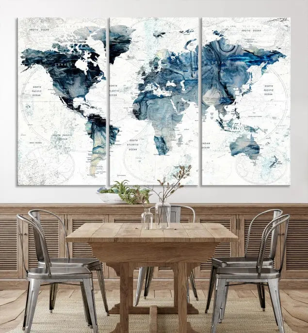 The Watercolor World Map Wall Art Canvas Print, a three-panel abstract masterpiece on museum-quality canvases, adorns the wall.