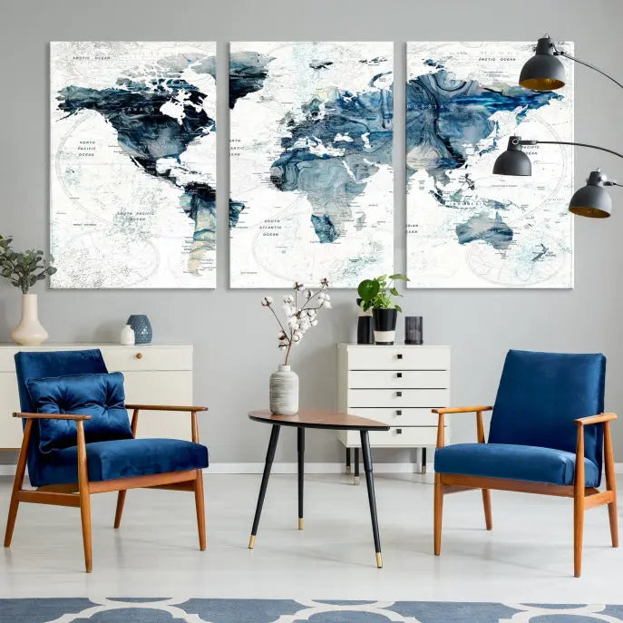 The Watercolor World Map Wall Art Canvas Print, a three-panel abstract masterpiece on museum-quality canvases, adorns the wall.