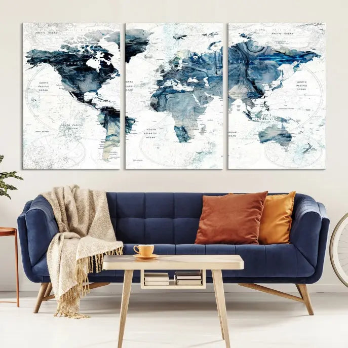 The Watercolor World Map Wall Art Canvas Print, a three-panel abstract masterpiece on museum-quality canvases, adorns the wall.