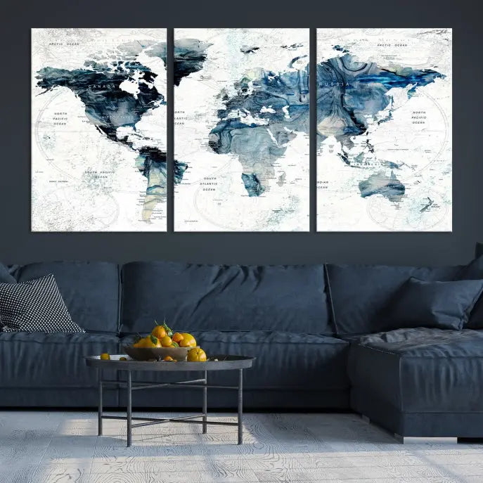 The Watercolor World Map Wall Art Canvas Print, a three-panel abstract masterpiece on museum-quality canvases, adorns the wall.