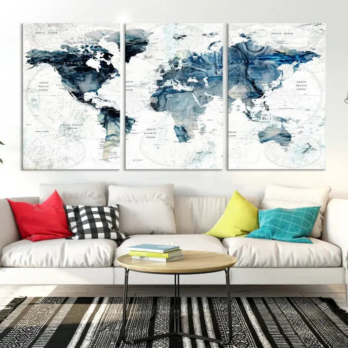 The Watercolor World Map Wall Art Canvas Print, a three-panel abstract masterpiece on museum-quality canvases, adorns the wall.